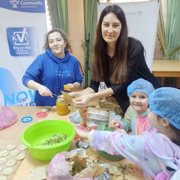 'Volunteers and Children at the Heart of Kindness' poster